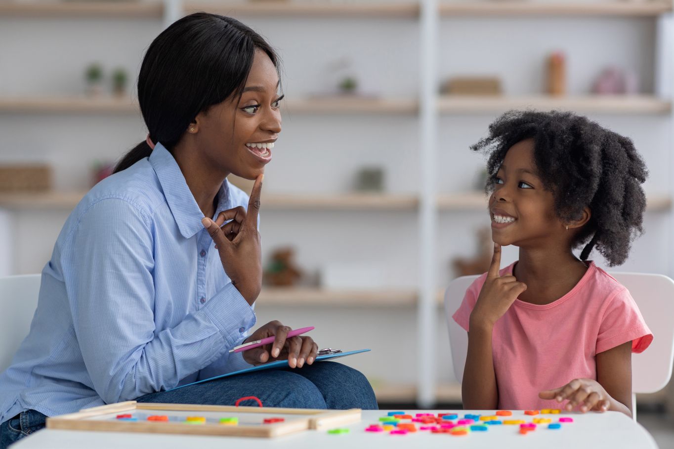 Speech therapy session child with speech therapist